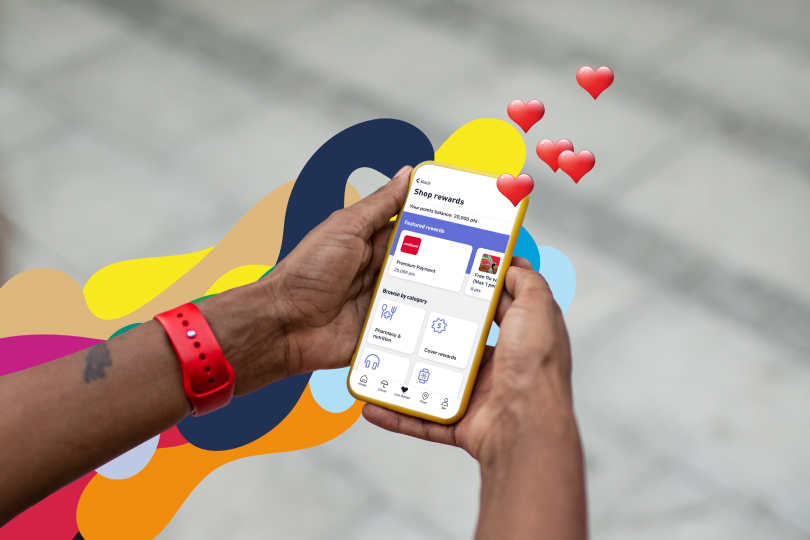 Man's hand holding phone with the Live Better shop rewards page open