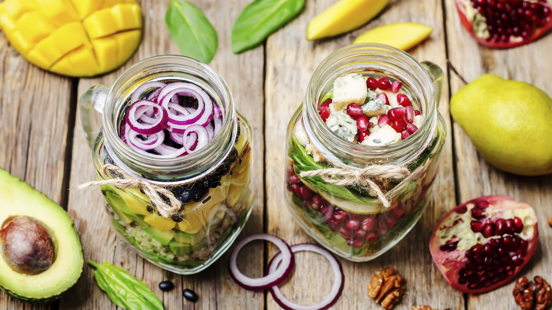 homemade healthy salads with vegetables, fruits, beans and quinoa in jar. toning. selective Focus