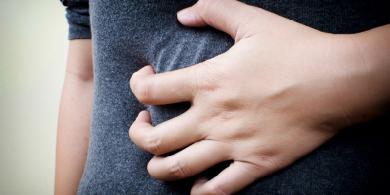A person holding their stomach