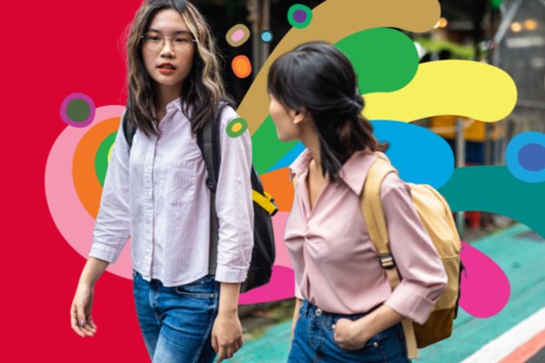Two women walking and talking