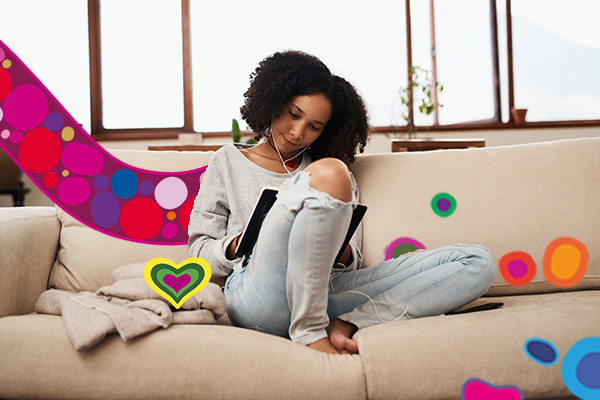 Woman journaling on couch