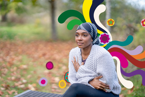 Woman sitting outside on grass