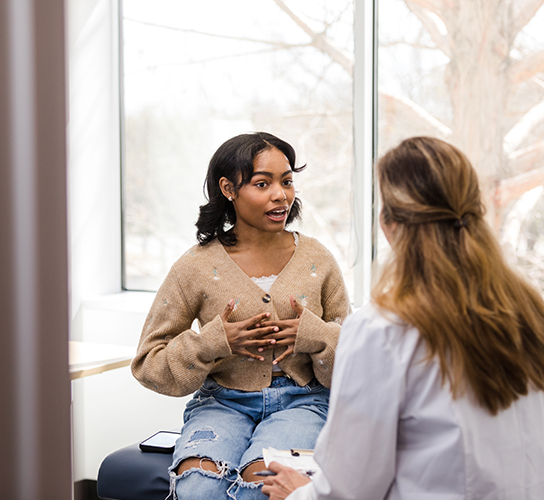 girl talking to health professional