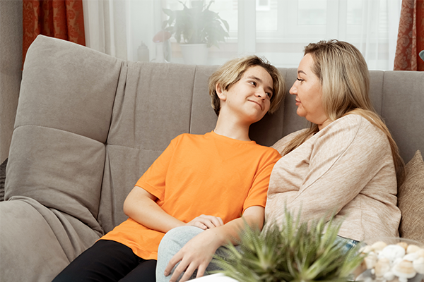 Young boy talking to mum