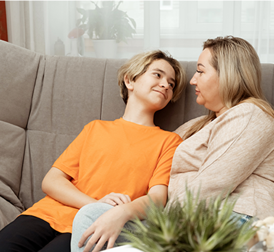 Young boy talking to mum
