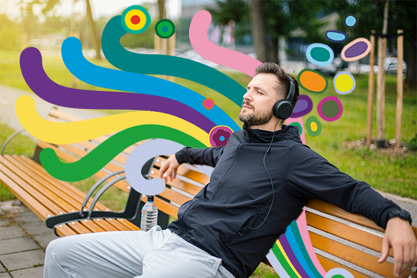 Man sitting down listening to music