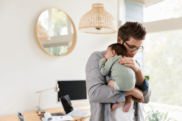 A mum applying face cream on her kid in bathroom