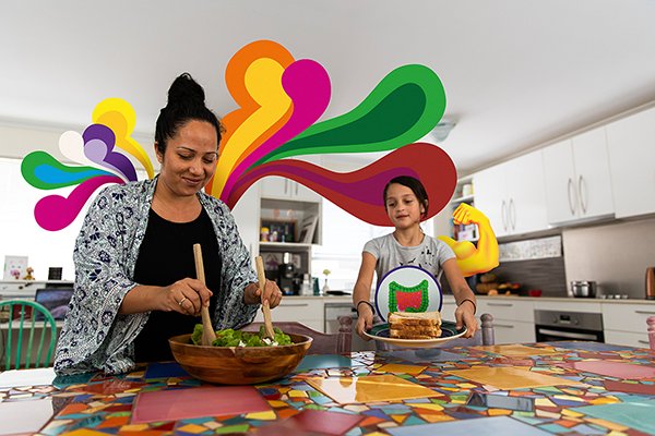 A mother and daughter preparing a meal in the kitchen