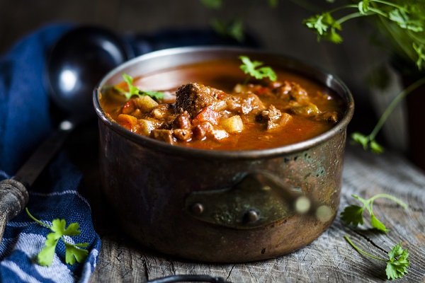 Goulash soup with flat leaf parsley