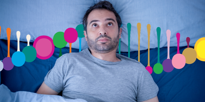 Man lying awake in bed