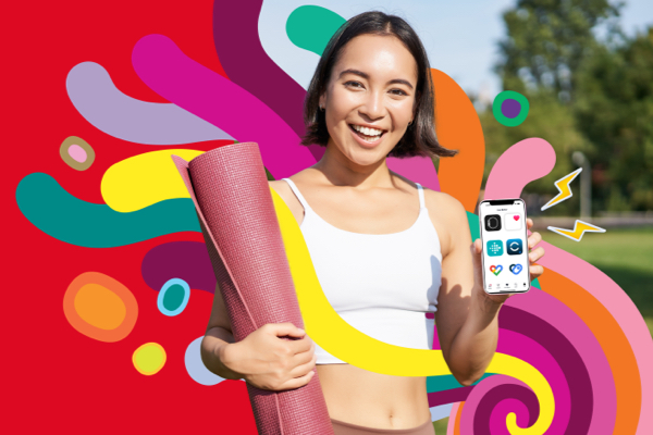 Smiling woman holding yoga mat and phone 