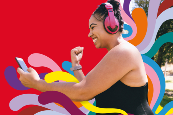 Woman smiling at phone while running 
