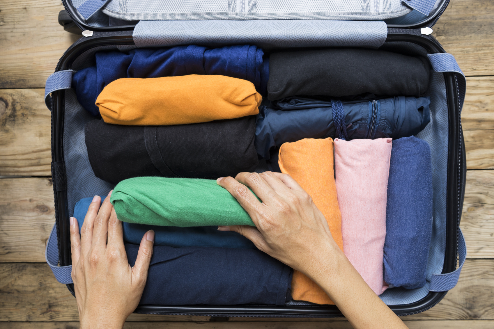 woman packing a luggage for a new journey