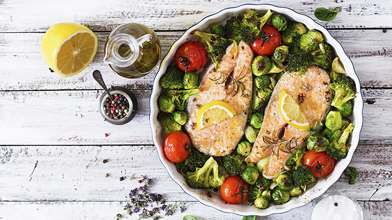 Baked salmon steak with vegetables. Diet menu. Top view