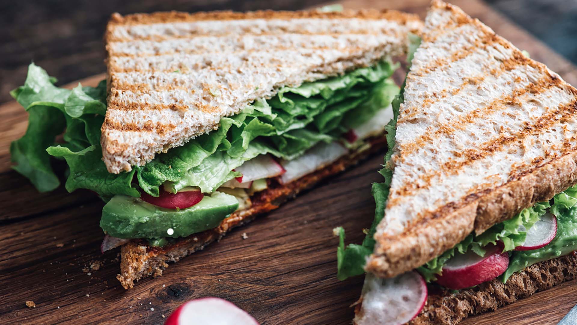 Sandwich with avocado,radish,salad and ajvar vegan