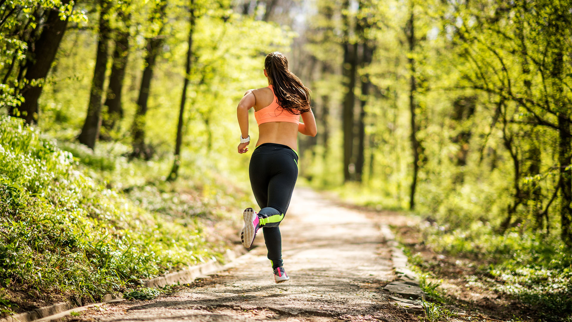 Female athlete running early in the morning during her cardio routine