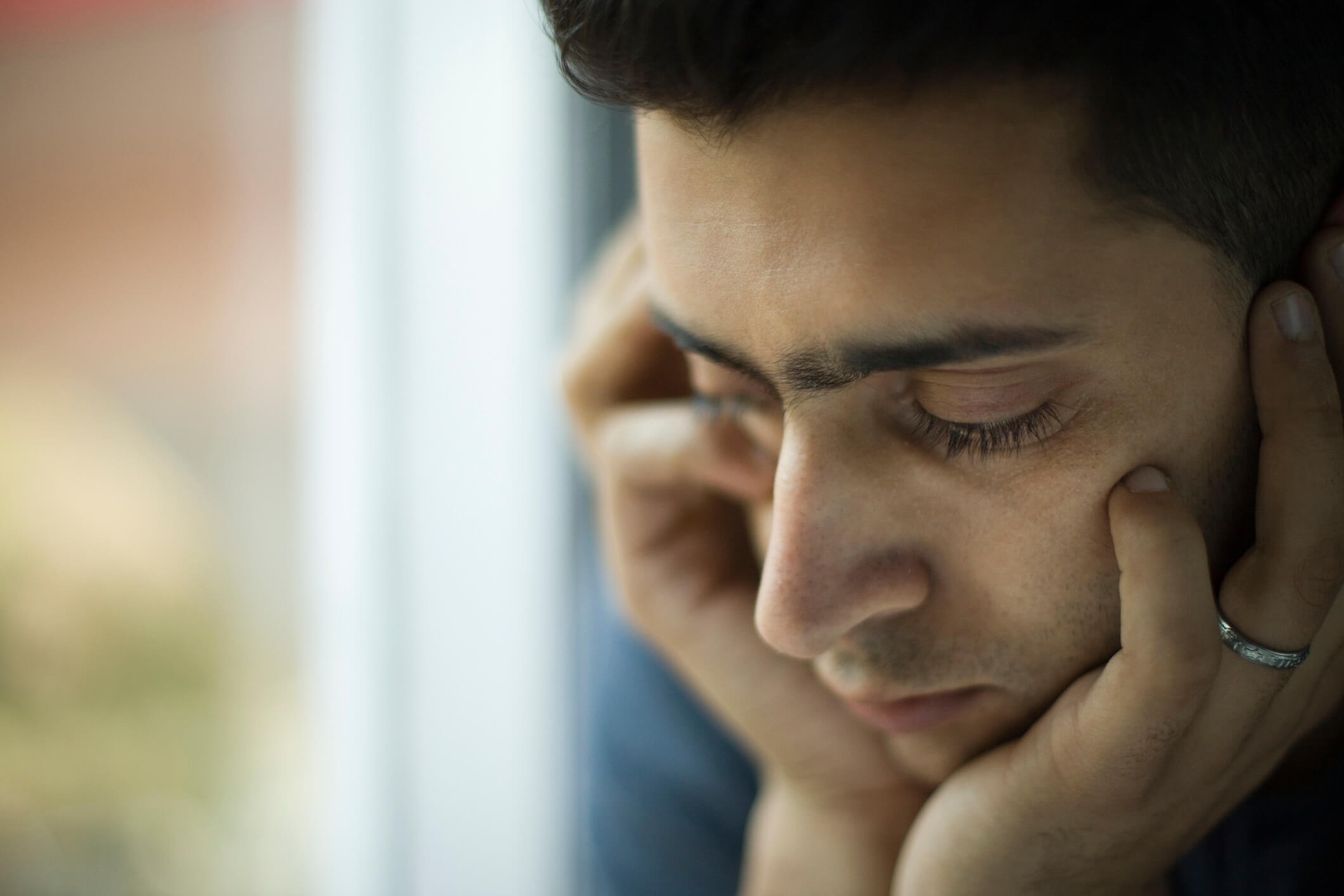 Young man experiencing depression during social isolation.