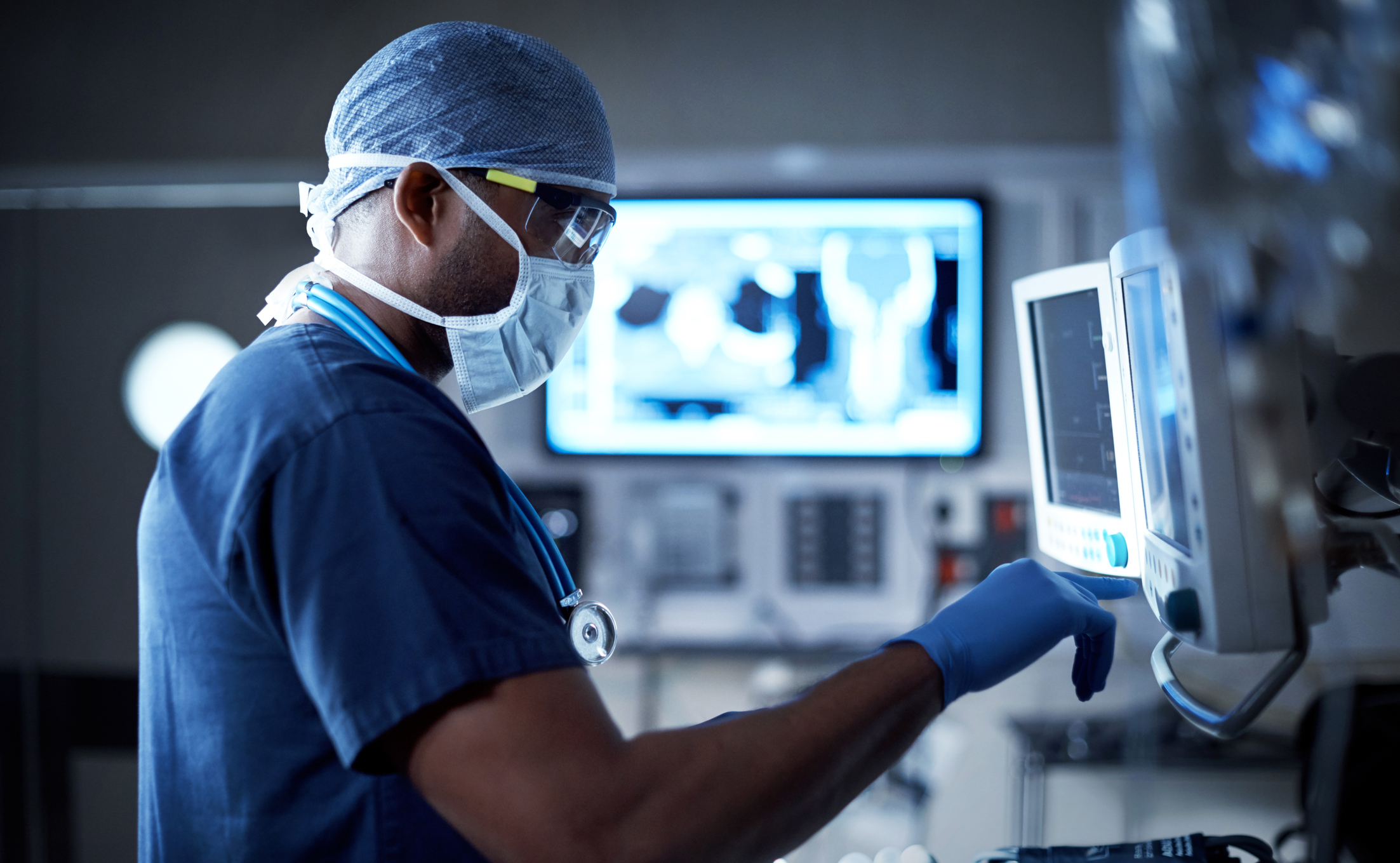 592647720 Shot of a surgeon looking at a monitor in an operating room
