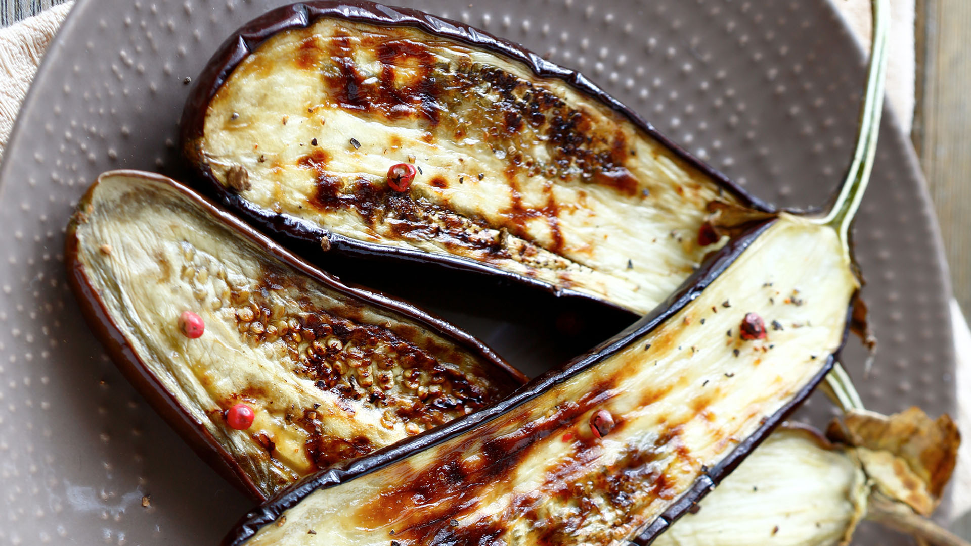 Eggplant  roasted on  plate, food closeup