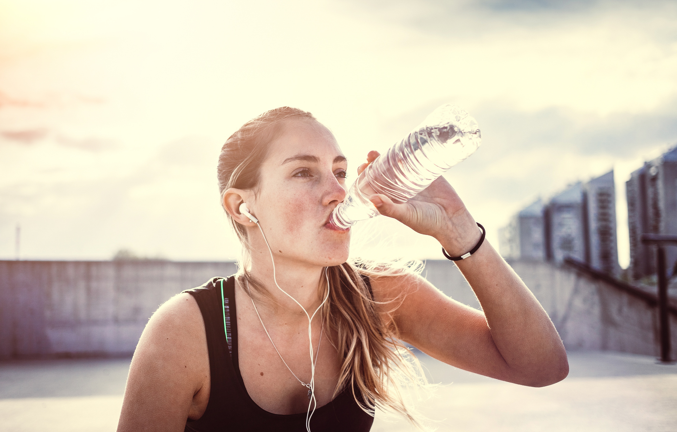 Young woman exercising fitness and drinking water