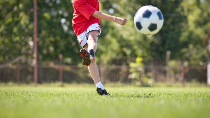 Choosing the right football boots is important for support.