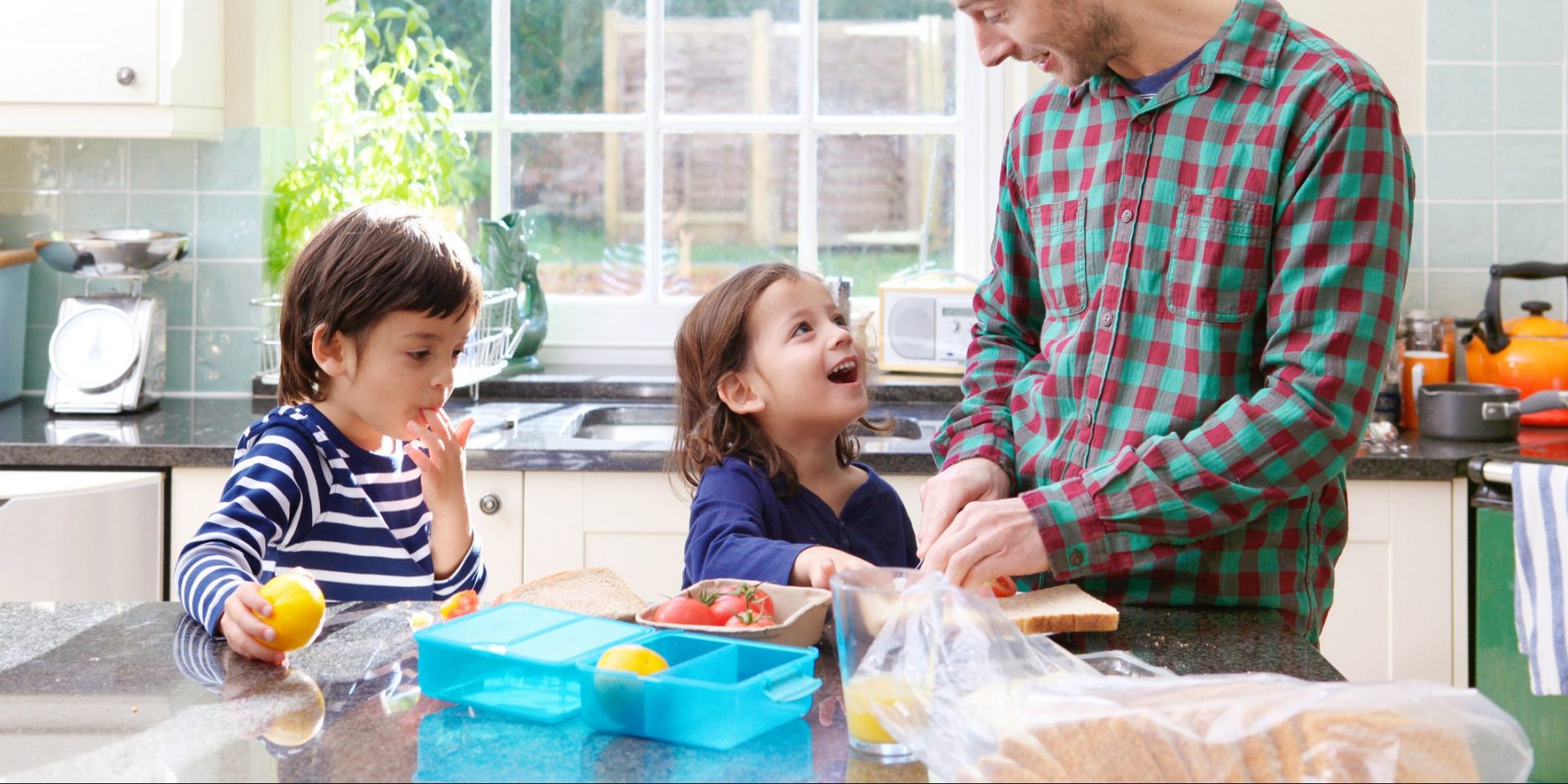 little brothers with father making lunch