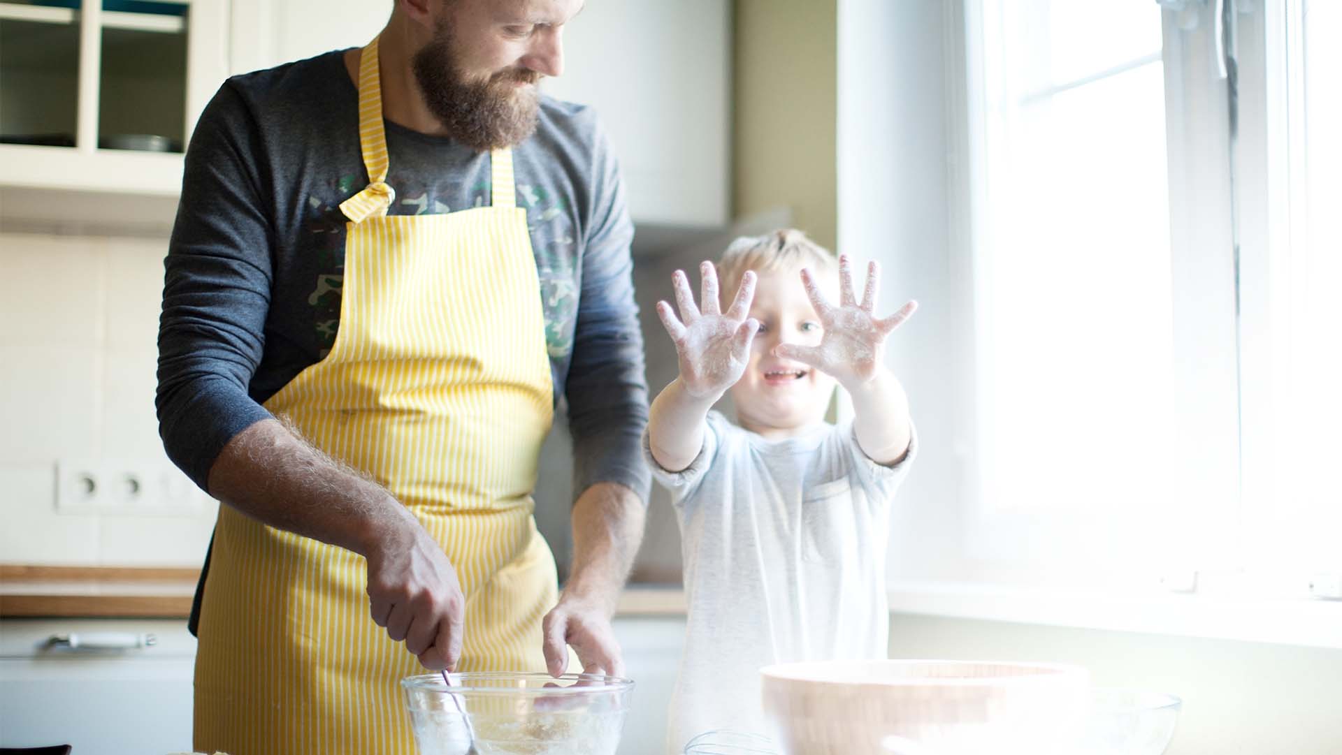 Father cooking with his son