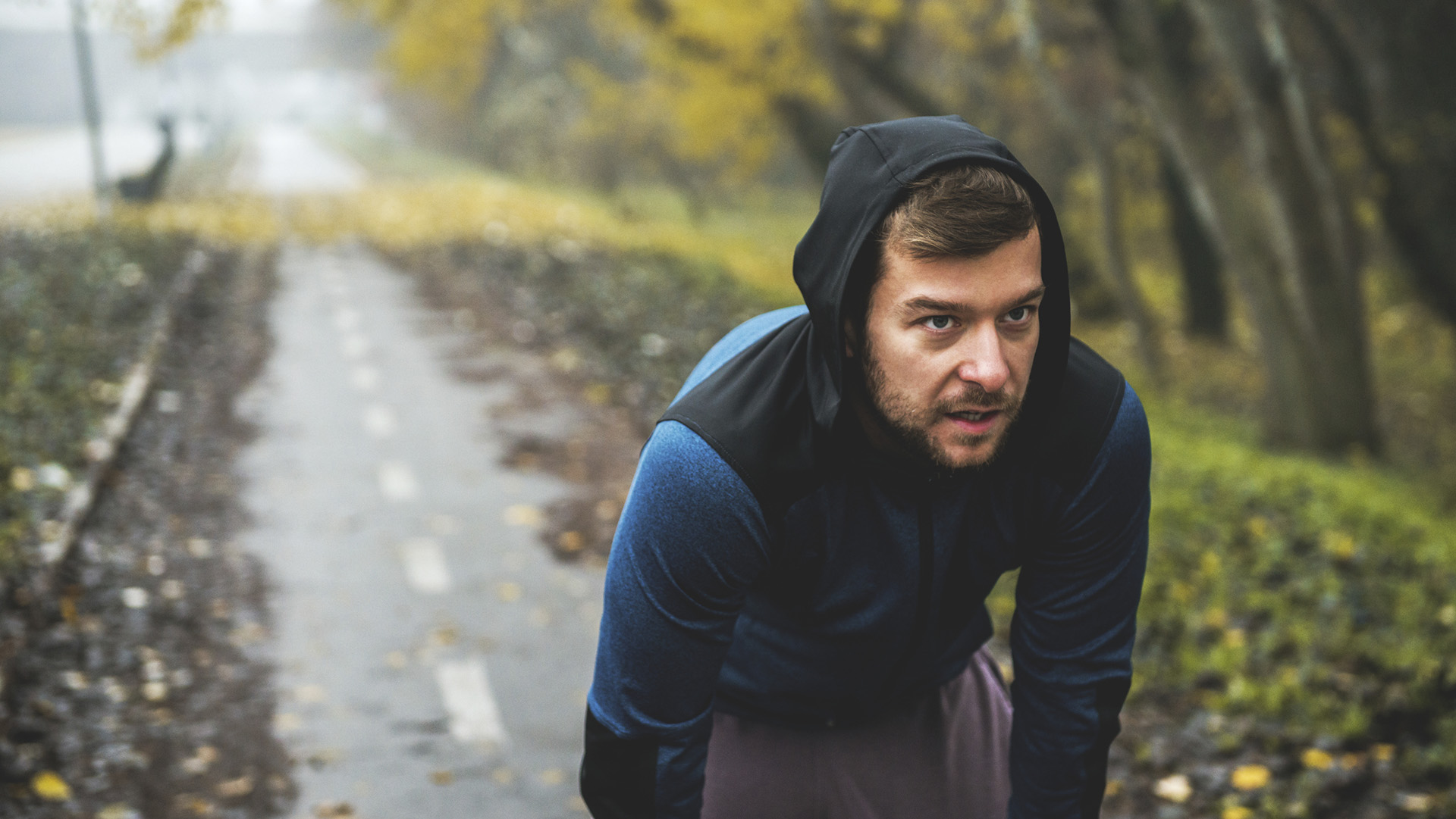 Shot of a man taking a break from running.