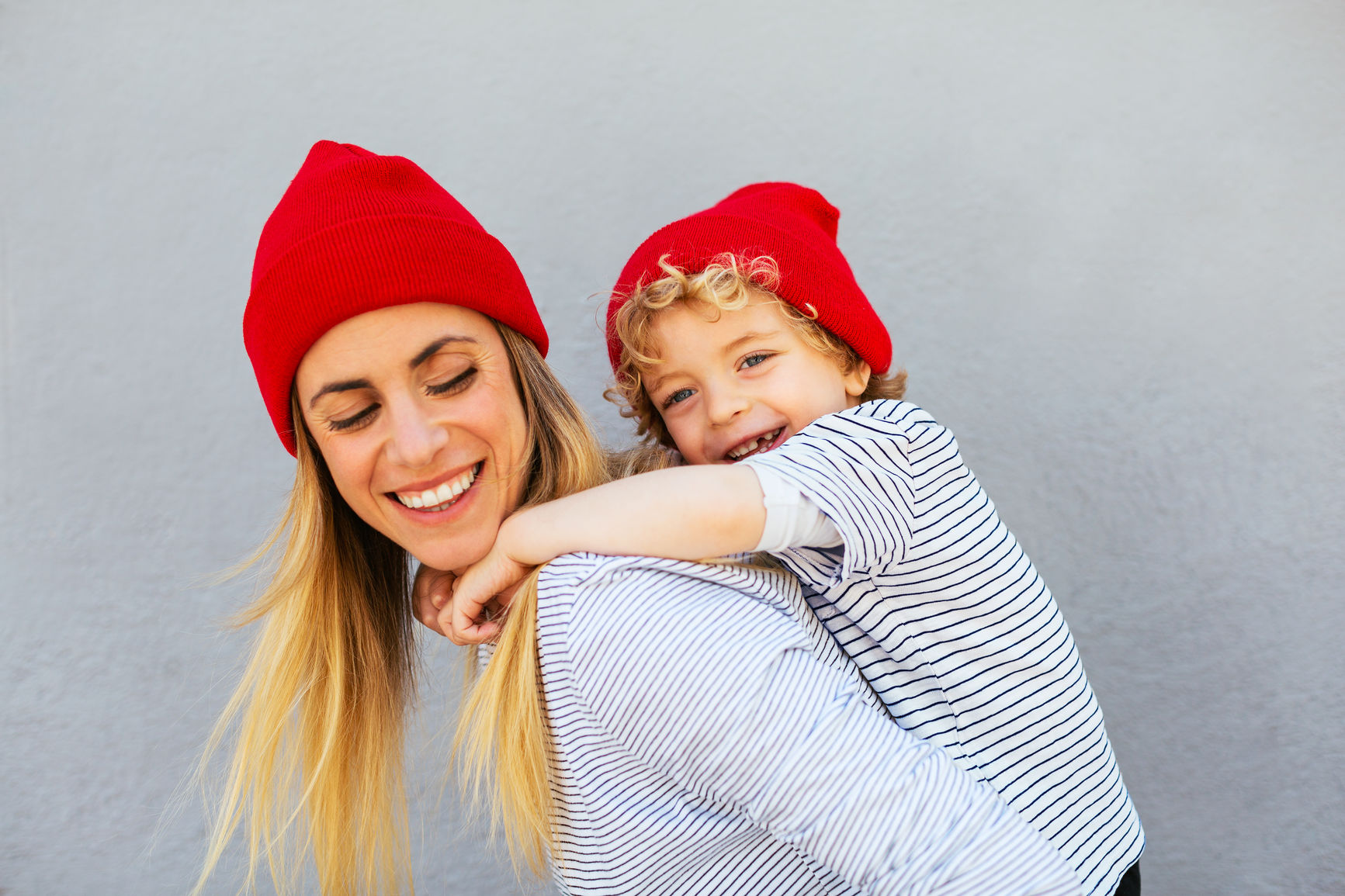 Mother and kid dress alike.