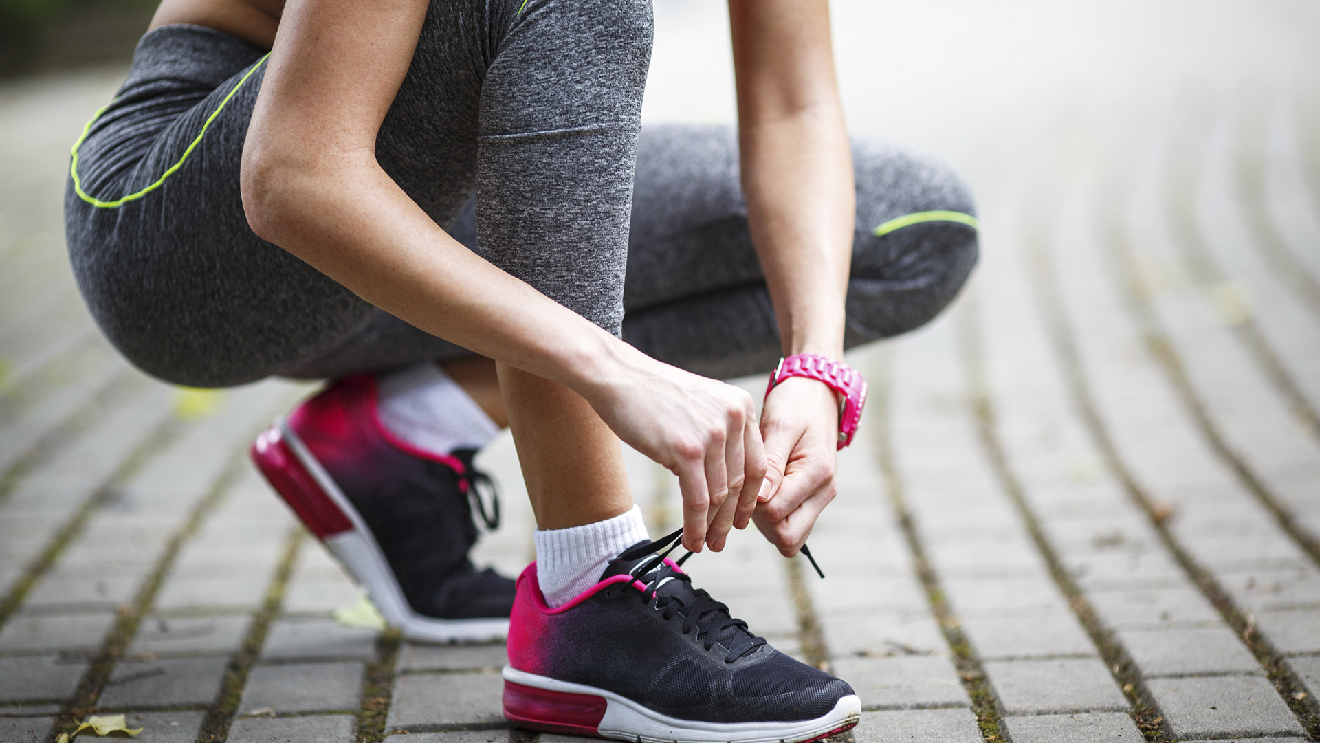 Women tied the laces on sport shoes.Preparing for jogging and workout.