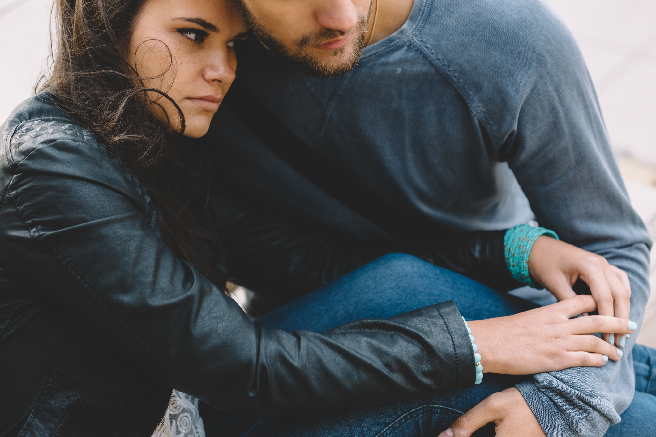 Depressed young couple outside