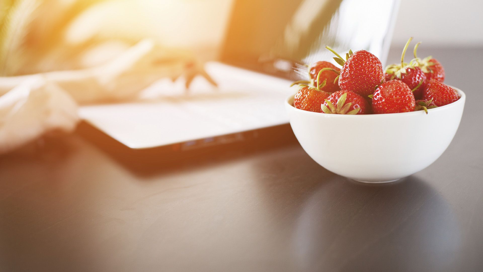 Healthy strawberry lunch on working desk