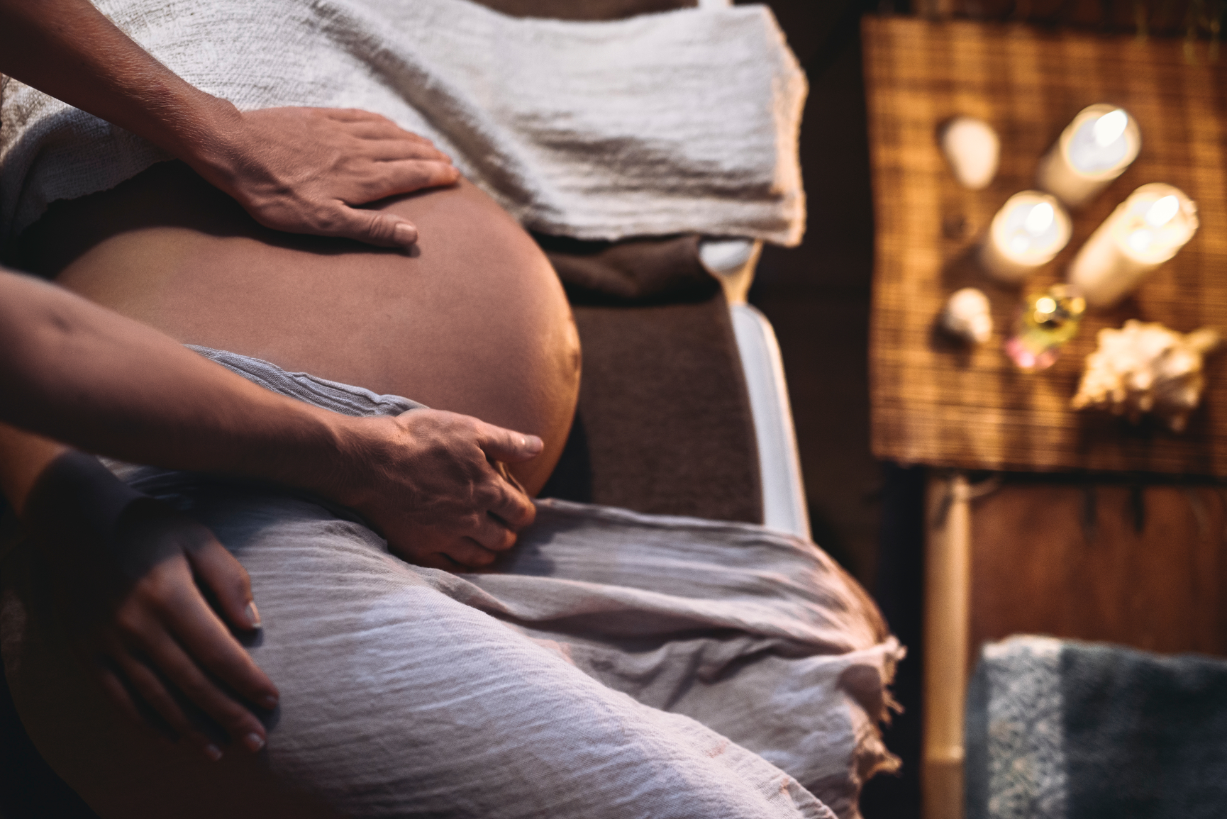 Pregnant woman relaxing in spa massage