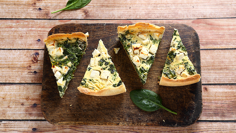 Tasty slices pie on a cutting board, hot food