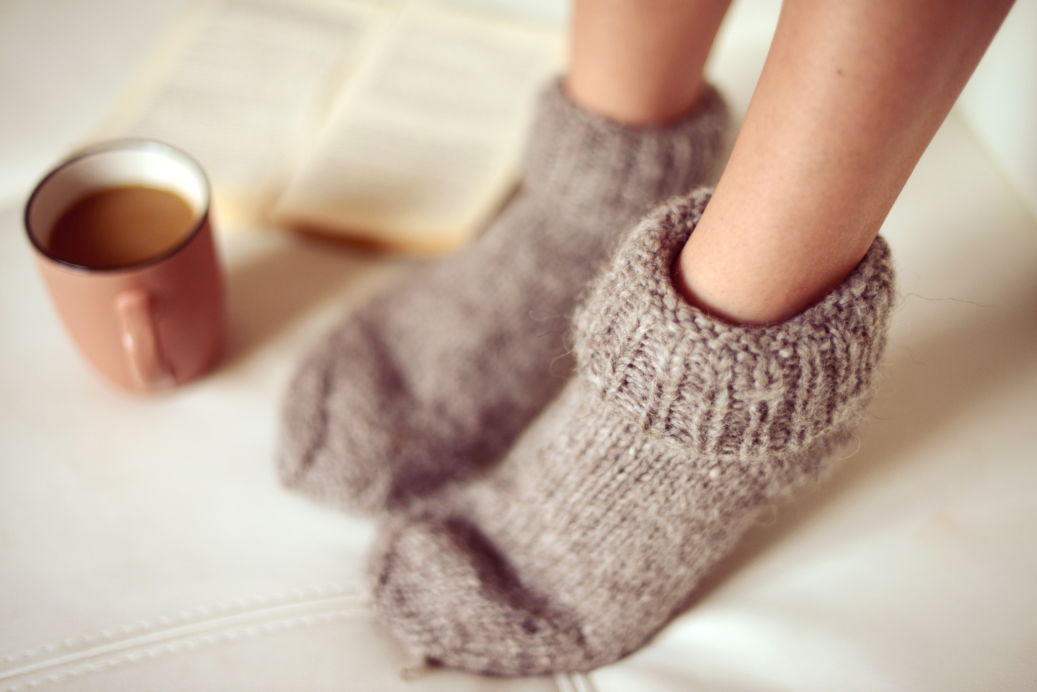 female legs in woolen socks close up