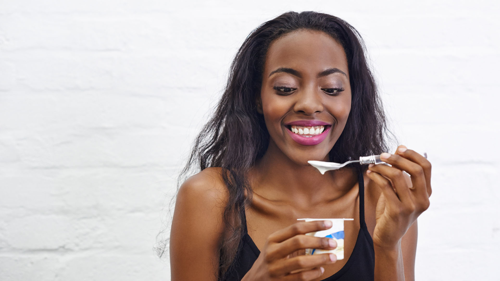 Shot of a beautiful woman eating yogurthttp://195.154.178.81/DATA/i_collage/pu/shoots/795690.jpg