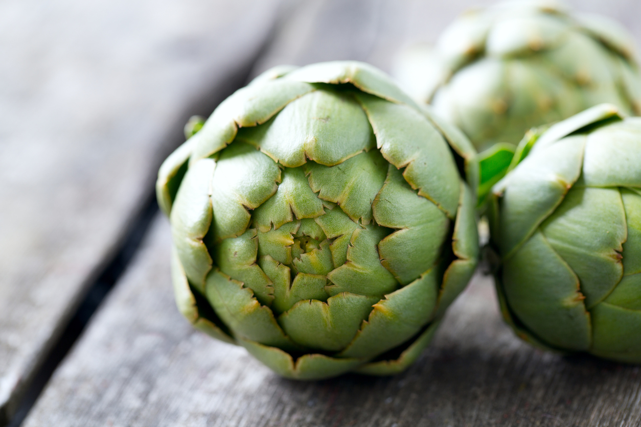 artichokes on wooden surface