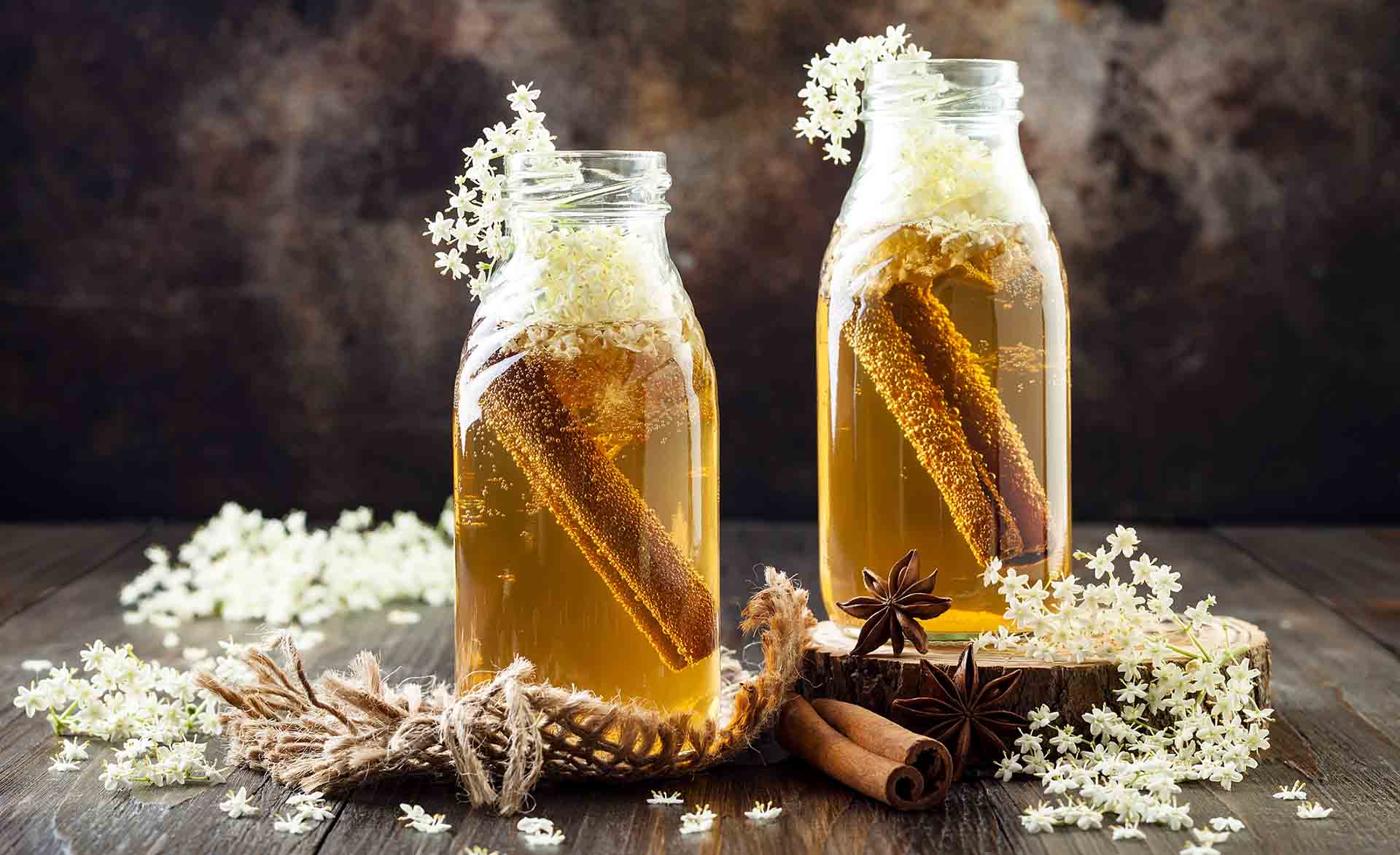 Homemade fermented cinnamon and ginger kombucha tea infused with elderflower. Healthy natural probiotic flavored drink. Copy space