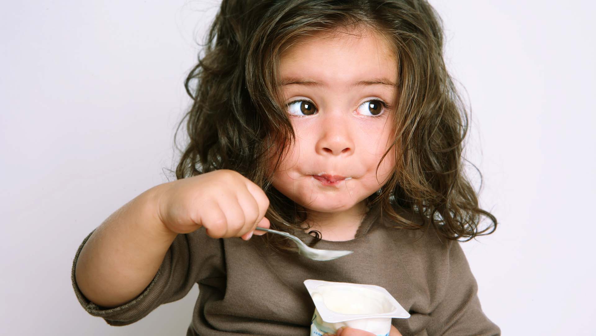 Girl eating yogurt