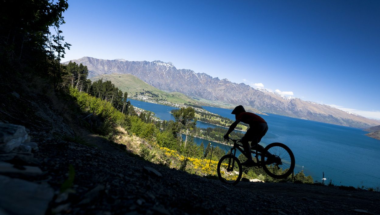Silhouette of mountain bike rider in Queenstown, New Zealand