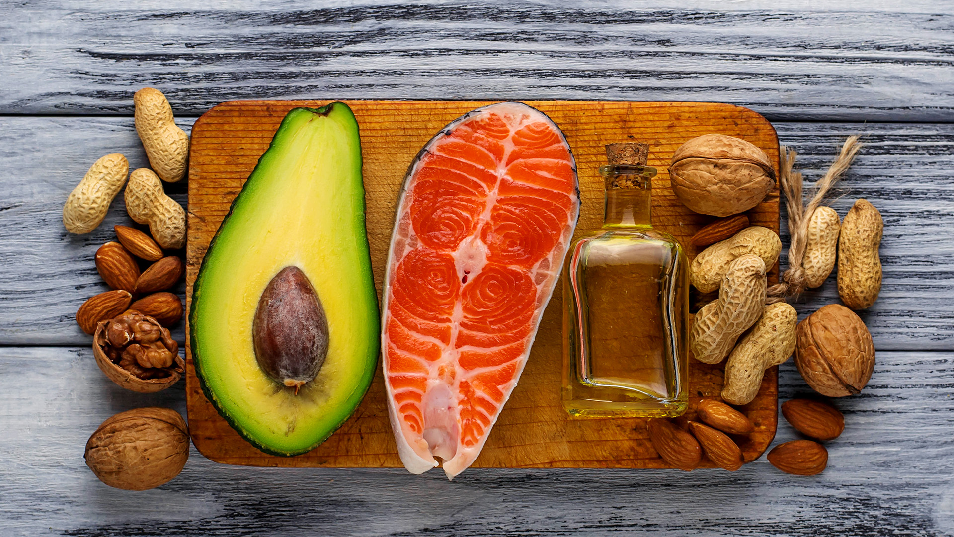 Healthy fat salmon, avocado, oil, nuts. Selective focus