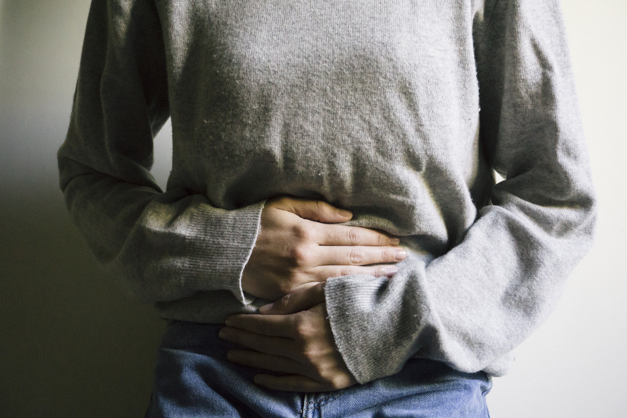 Woman suffering from stomach ache