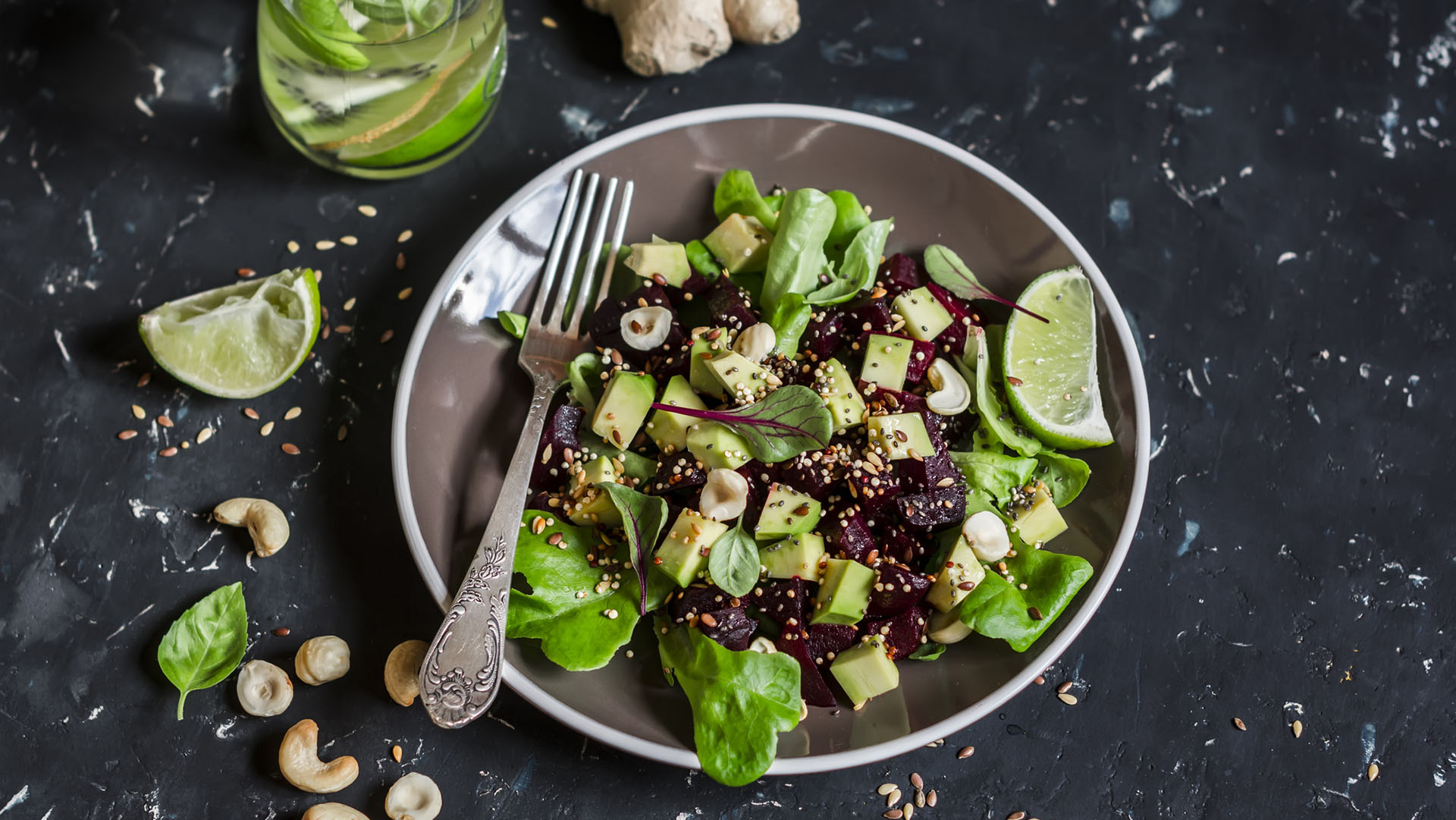 Beet and avocado detox salad. On a dark background. Healthy vegetarian food