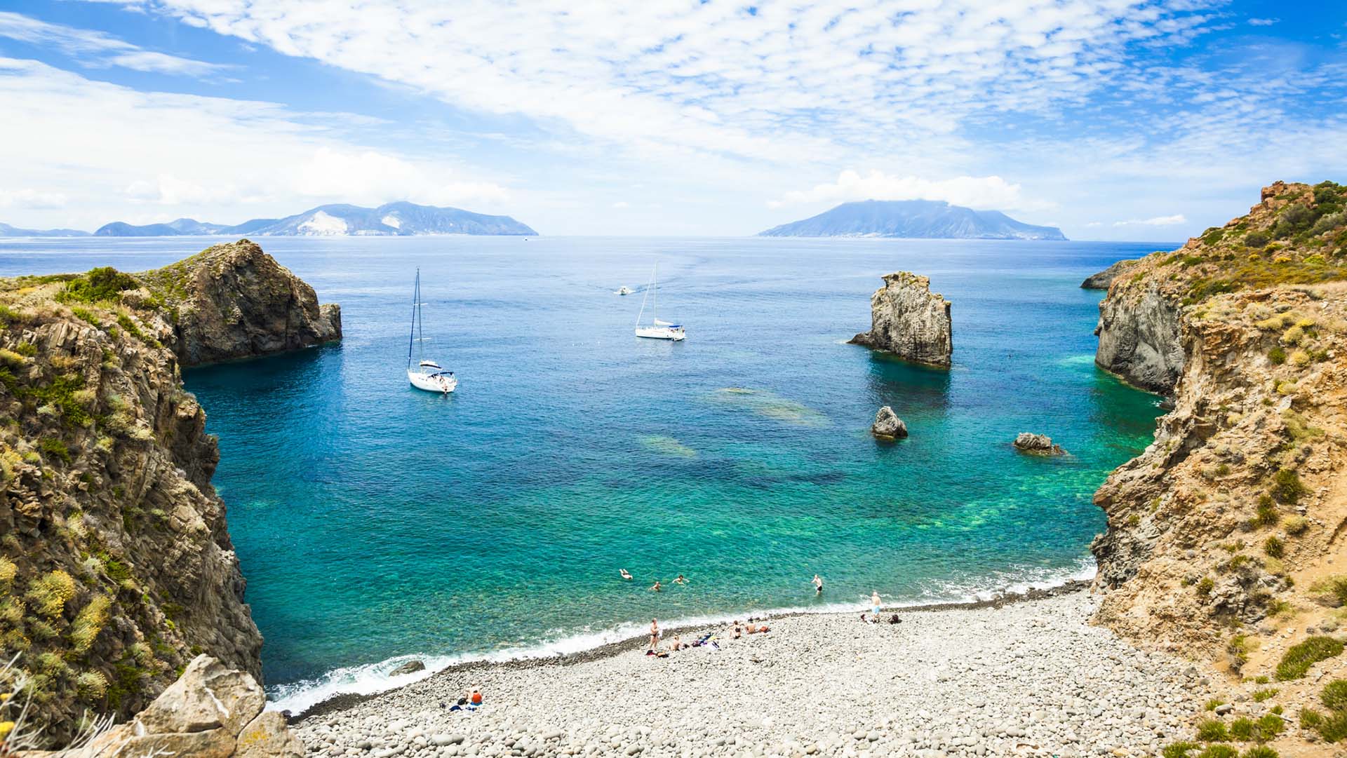 Cala Junco - small bay of Panarea - one of Aeolian Islands near Sicily (Italy). Lipari and Salina islands visible on the horizon.