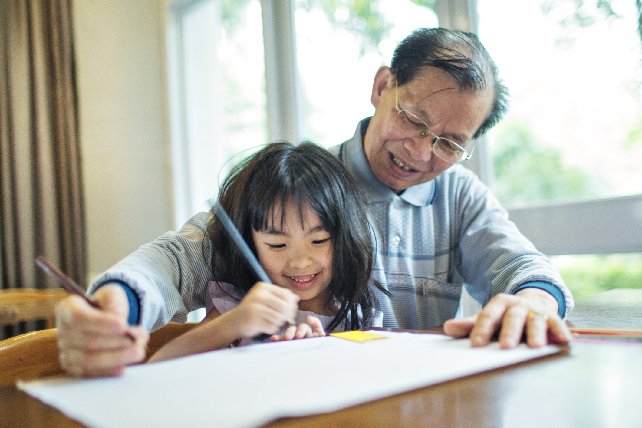 Grandfather spending time with granddaughter.