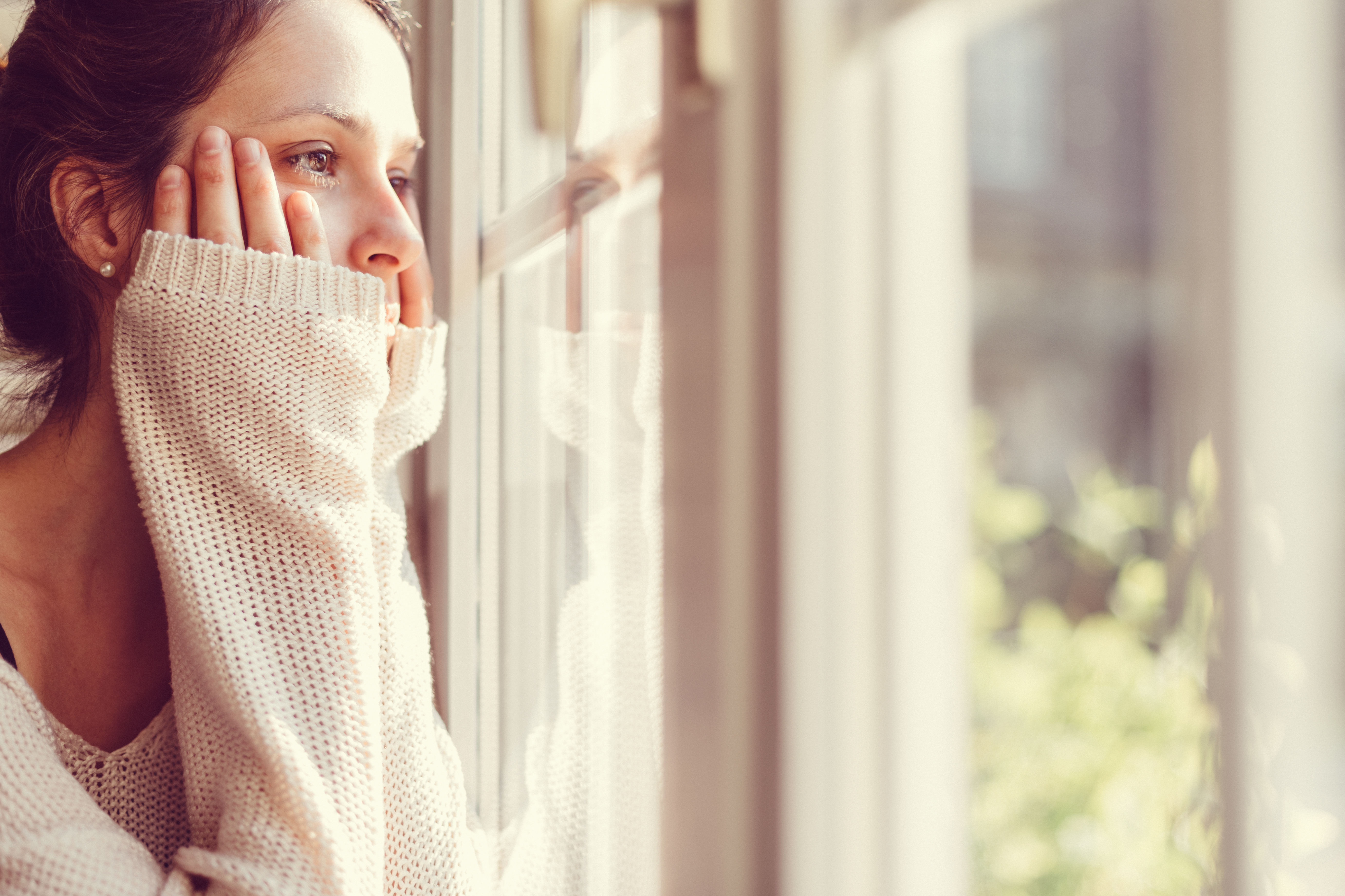 Thoughtful woman at home - copyspace