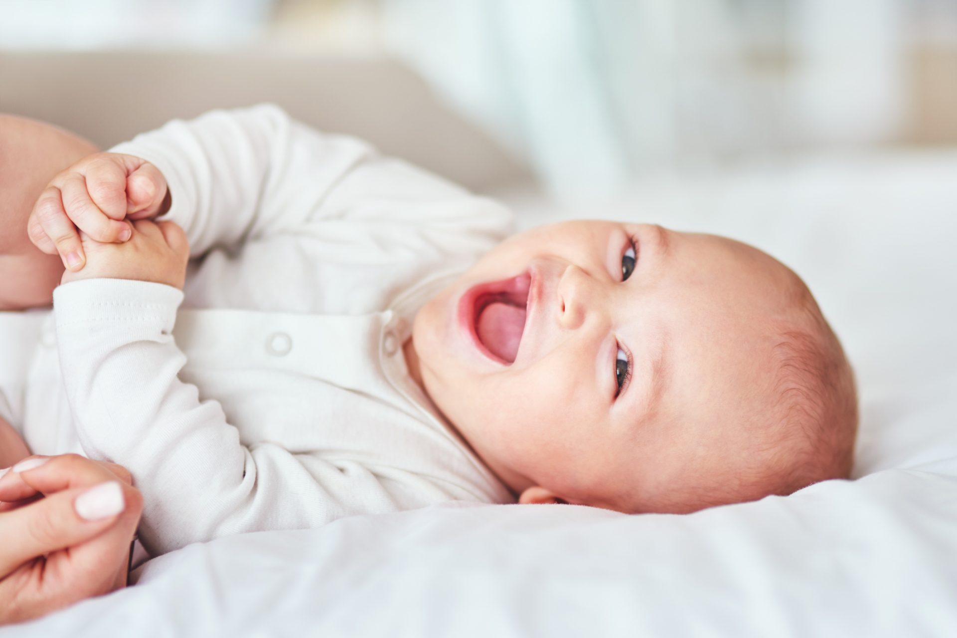 Shot of an adorable baby boy bonding with his mother at home