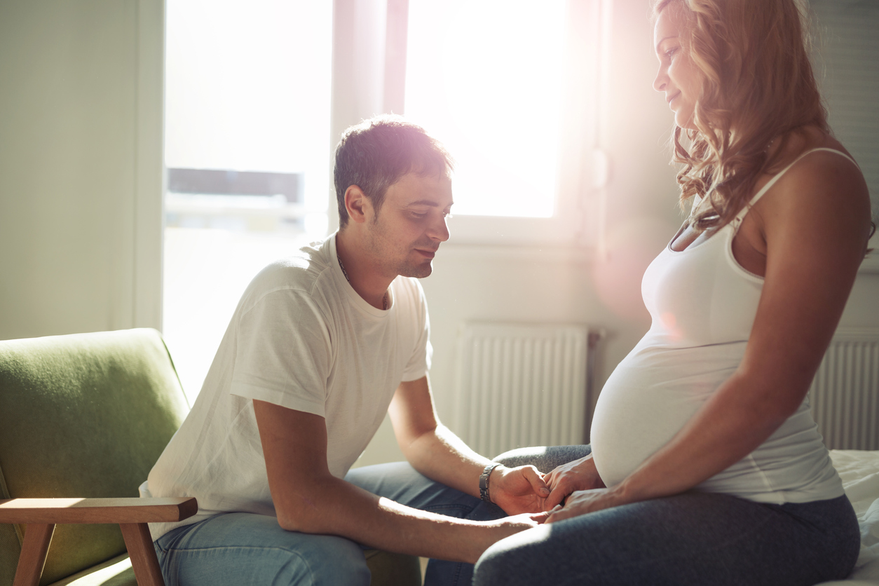 Stressful couple awaiting baby faced with difficulties requiring understanding