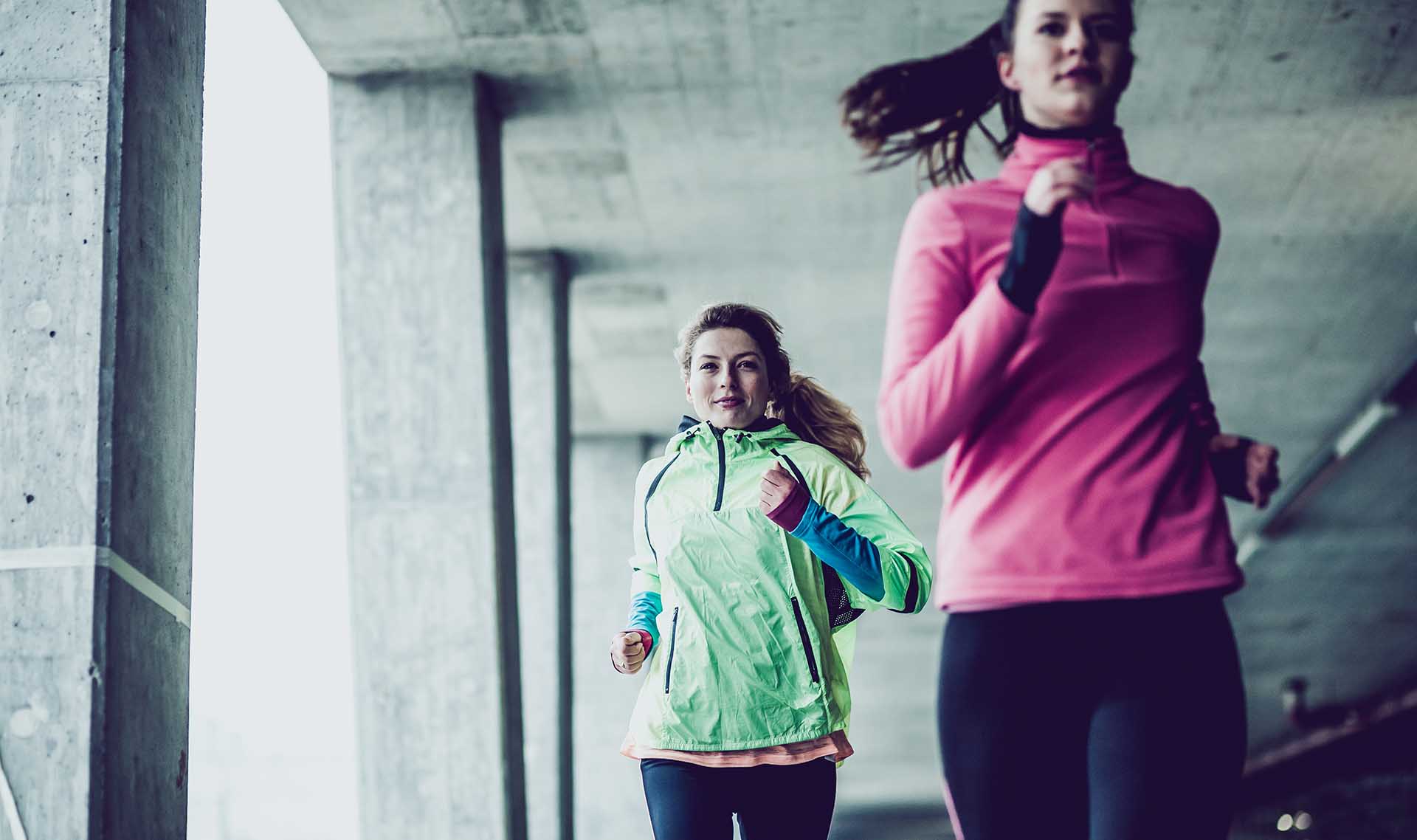 Two woman running at the winter day, Ljubljana, Slovenia