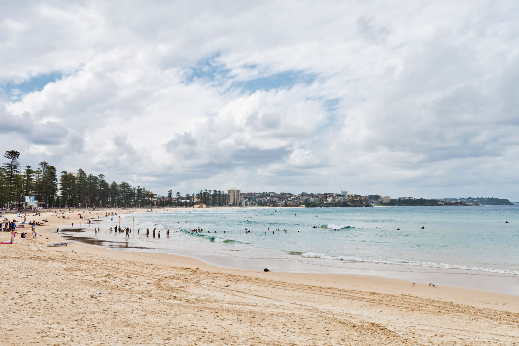 Manly Beach still very active even on a cloudy day.